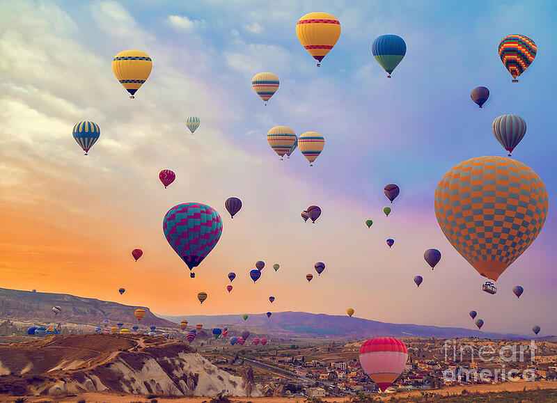 hot-air-balloons-flying-over-mountains-vladyslav-danilin