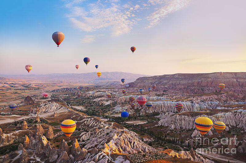 hot-air-balloon-flying-over-rock-tatiana-popova