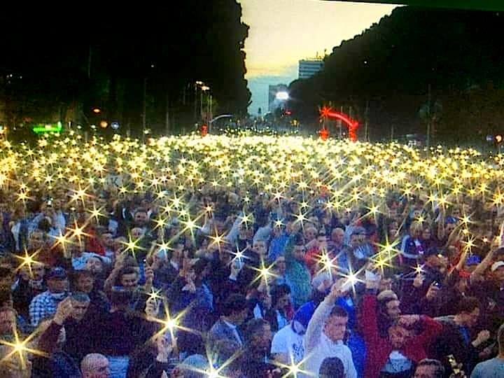 Image may contain: one or more people, crowd and outdoor